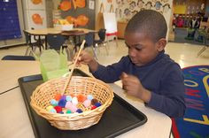 ... /Asia theme. Using chopsticks move the pom pons to the take out box