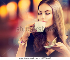 Little Girl Drinking Coffee Beautiful girl drinking tea or