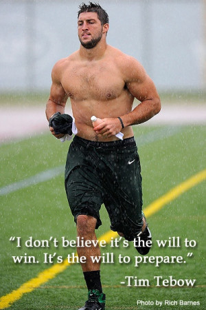 Tim Tebow running in the rain during a NY Jets practice. For insider ...