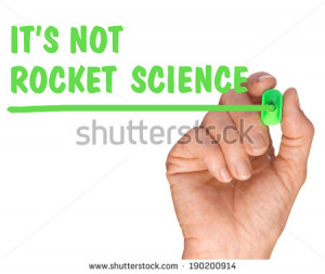 Hand with Pen Writing its not rocket science quote - success concept ...