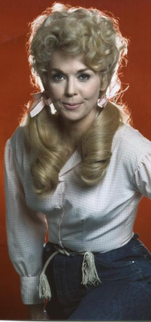 Donna Douglas as Elly May Clampett