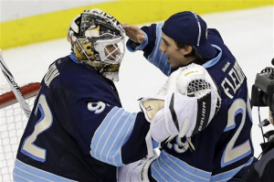 Vokoun (92) and Marc-Andre Fleury (29) celebrate after a 2-0 shutout ...