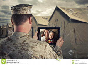 deployed military men talks with his family via video chat.