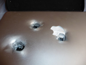 Check out more images of the bullet ridden MacBook below:
