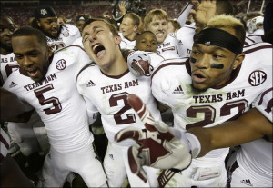 Texas A&M quarterback Johnny Manziel (2) is joined by wide receiver ...