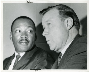 ... Jr. (shownwith labor union leader Walter Reuther) prepares to speak