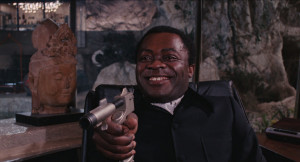 Live_and_Let_Die_-_Kananga_threatens_Bond_with_his_own_weapon.png