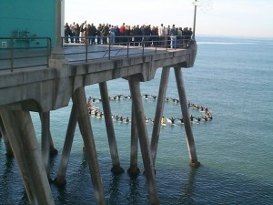 Close friends and family hold a paddle-out ceremony for a surfer who ...