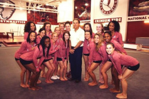 Nick Saban Posed With the Alabama Gymnastics Team, Cracked a Grin
