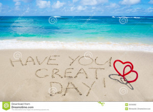 Sign Have you great day! with two hearts on the sandy beach by the ...