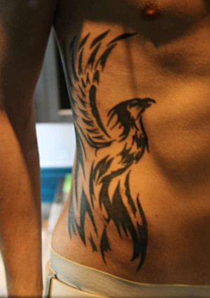 ... rising phoenix tattooed on the ribs making a great looking side tattoo