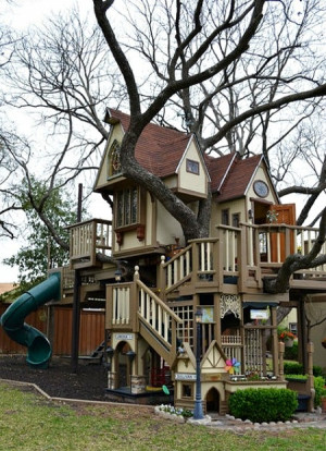 The ultimate tree house for kids equipped with a climbing wall, rope ...