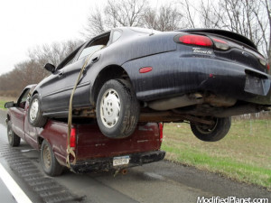 car-photo-1999-ford-taurus-on-back-pickup-truck-bed-car-fail-funny