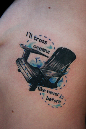 chair and ocean rib tattoo