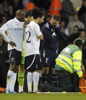 The medical team tend to Bolton Wanderers' Fabrice Muamba who