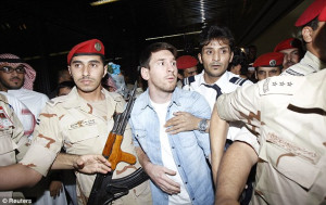 Mobbed: Messi (centre) and Aguero are in Saudi Arabia on international ...