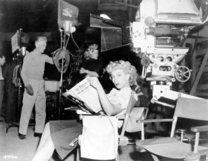 Ann Sothern catches up on the latest in entertainment news on the set ...