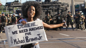 ... line of riot police in Ferguson, Mo. on Wednesday, Aug. 13, 2014