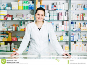 happy cheerful pharmacist chemist woman standing in pharmacy drugstore ...