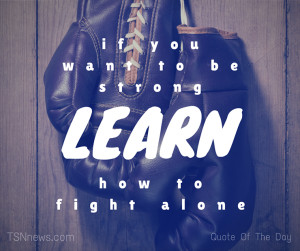 picture of boxing gloves hanging on wall with quote in foreground