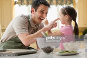 High-Res Stock Photography: Father and daughter having fun baking