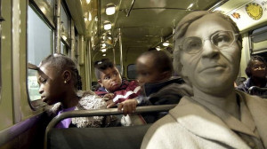 Strength and courage ... visitors with a statue of Rosa Parks on a ...