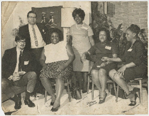 ... , seated at left, at a meeting of the Mississippi Freedom Labor Union