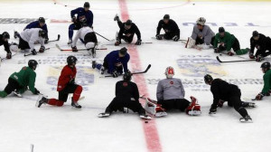 Team Canada players take a knee during practice at the IIHF World ...