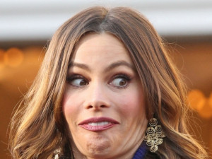 Sofia Vergara is looking in amazement at the small stature of Ryan ...