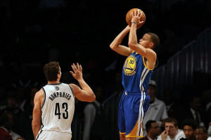 ... warriors point guard stephen curry 30 shoots over brooklyn nets power