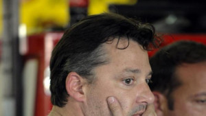 NASCAR driver Tony Stewart stands in the garage after practice for ...