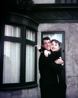 ... and Audrey Hepburn enjoy a friendly hug on the set of Sabrina , 1953
