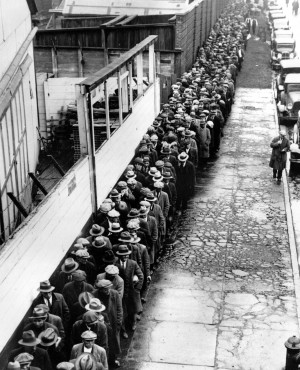 Press In this 1932 file photo, long line of jobless and homeless men ...