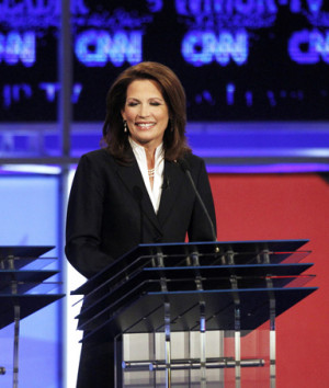 Rick Santorum and Newt Gingrich applaud U.S. Rep. Michelle Bachmann ...