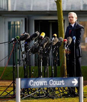 The founder of WikiLeaks Julian Assange speaks to the media after his ...