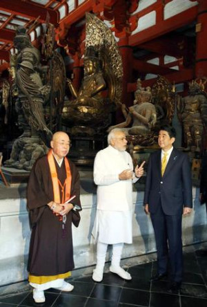 Prime Minister Narendra Modi, center, and his Japanese counterpart ...