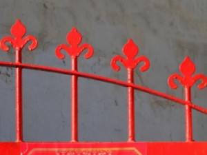 Parts of an iron gate that are equidistant.