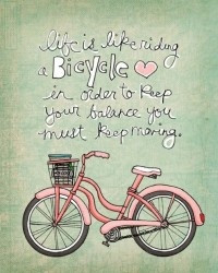life is like riding a bicycle. in order to keep your balance you must ...