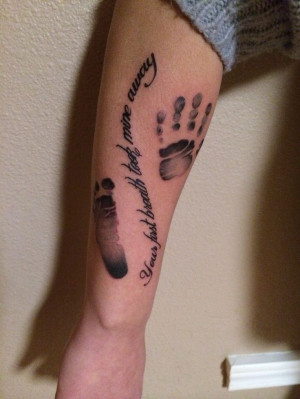 Handprint and footprint tattoo.