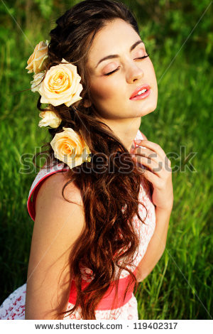 stock-photo-beautiful-woman-with-flowers-in-her-hair-119402317.jpg