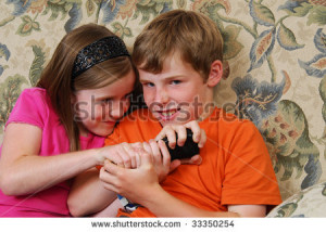 Brother and sister fighting over the TV remote control