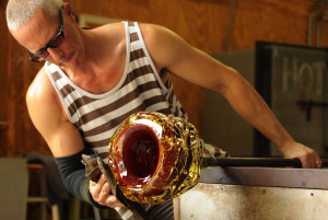 Cal Breed creates a glass bowl from molten glass at his studio ...