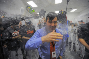 Orioles executive vice president Dan Duquette gets doused in champagne ...