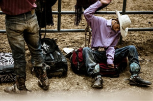 young hopeful practices his bronc riding technique next to the main ...
