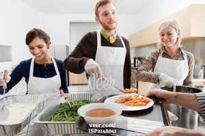 People volunteering at soup kitchen Stock Photo