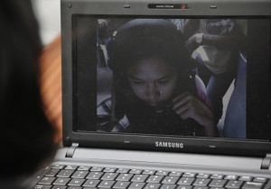 Susan Famadula's daughter Reliza is seen on a computer screen as they ...