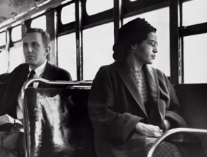Rosa Parks sitting in the white section of a bus.