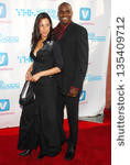 Small photo of HOLLYWOOD - APRIL 30: Carl Lewis and guest at Movieline ...