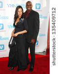 Small photo of HOLLYWOOD - APRIL 30: Carl Lewis and guest at Movieline ...