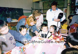 Foreigners play with the children